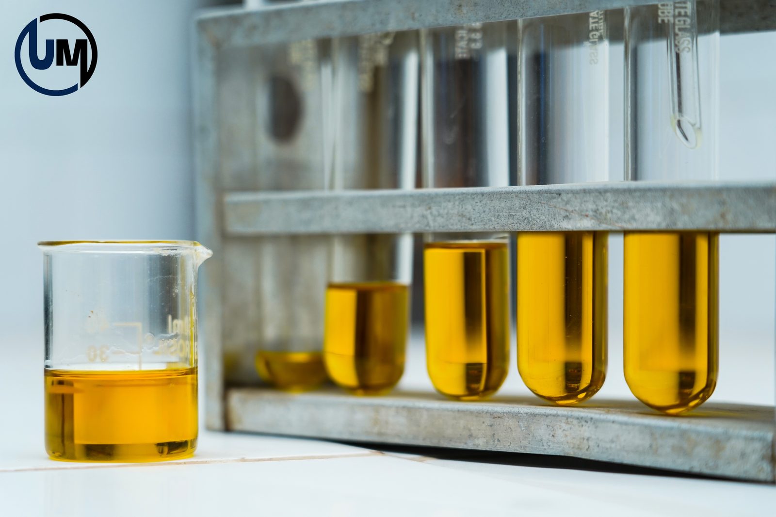 Bleach Master oil quality testing — golden oil samples in laboratory